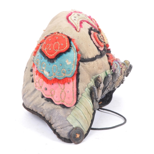 299 - An early 20th century Qing Dynasty silk embroidered Chinese - Oriental textile mask hat. A children'... 