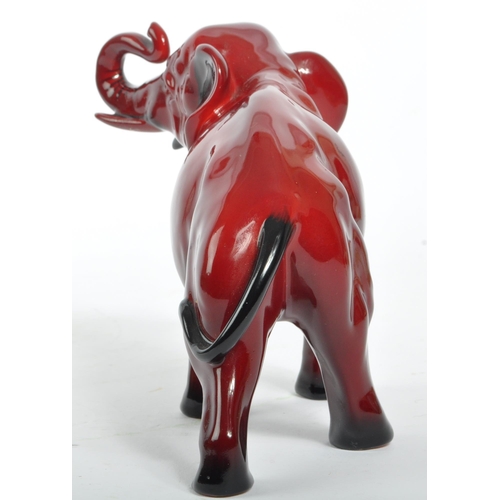 30 - A 20th century Royal Doulton ceramic china flambe elephant statue figure. The figure being in the fo... 