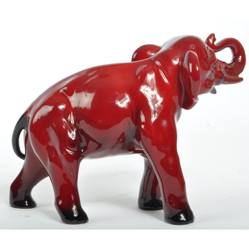 30 - A 20th century Royal Doulton ceramic china flambe elephant statue figure. The figure being in the fo... 