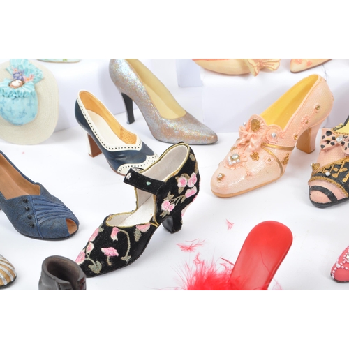 300 - A large collection of approximately thirty unboxed ' just the right shoe figurines by 'Raine' and 'L... 