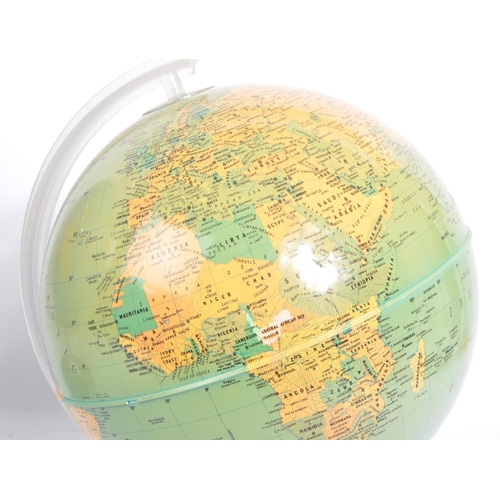 306 - Two 20th Century vintage world desktop globes both held upon silver circular bases. The larger one m... 