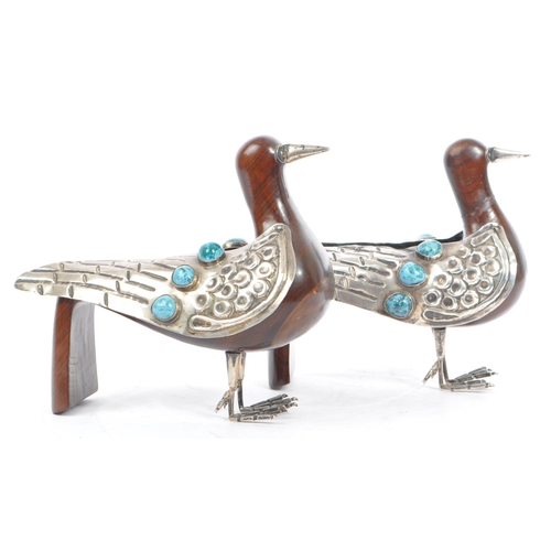 307 - A pair of 20th Century carved wood and silver folk art style candle holders in the form of two doves... 