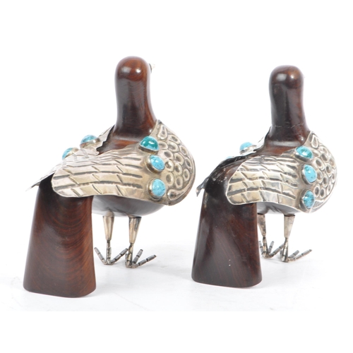 307 - A pair of 20th Century carved wood and silver folk art style candle holders in the form of two doves... 