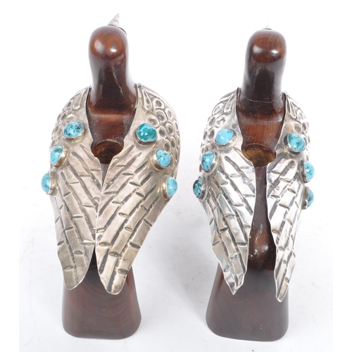 307 - A pair of 20th Century carved wood and silver folk art style candle holders in the form of two doves... 