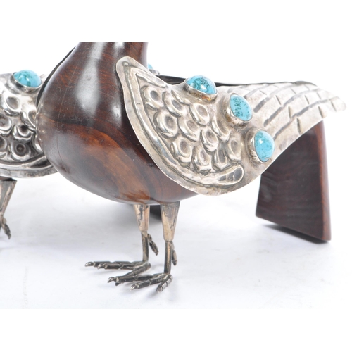 307 - A pair of 20th Century carved wood and silver folk art style candle holders in the form of two doves... 