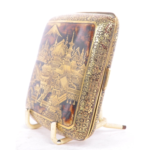 309 - A 1940's mid Century Chinese brass cigarette case with scenic design depicting Chinese houses and la... 