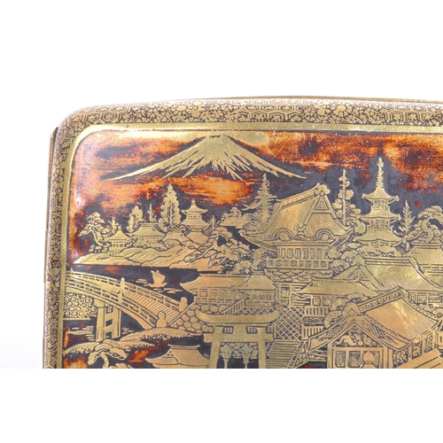 309 - A 1940's mid Century Chinese brass cigarette case with scenic design depicting Chinese houses and la... 