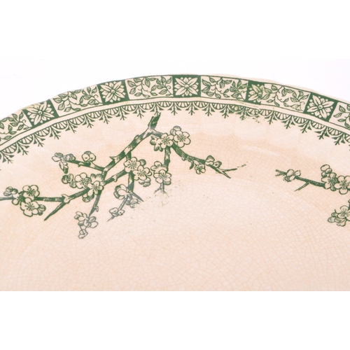 31 - A Victorian green and white dinner service by Keeling & Co - Late Myers 'Cherry Blossom' pattern to ... 