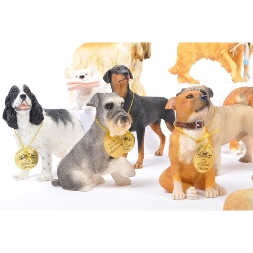 314 - A large collection of twenty unboxed dog study figurines by 'The Leonardo Collection' and others. To... 