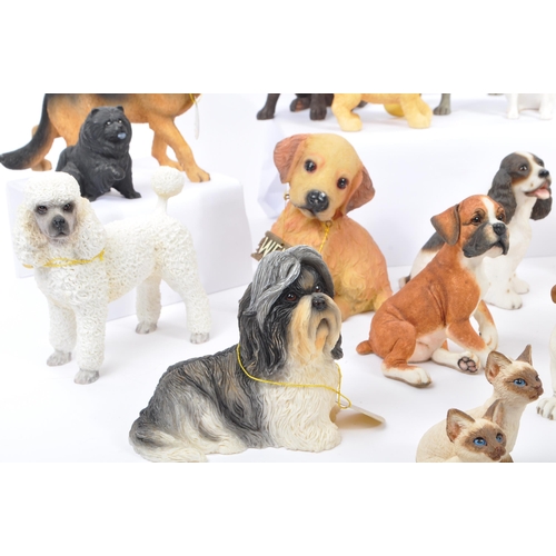 316 - A large collection of twenty unboxed dog study figurines by 'The Leonardo Collection' and others. To... 