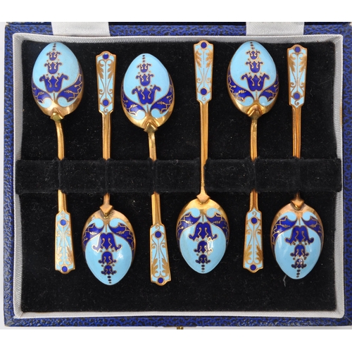 318 - A vintage 20th century enamelled teaspoon set. A set of six with cobalt blue & sky blue enamel decor... 