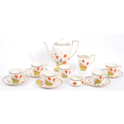 33 - A 1930S Art Deco hand painted 'Poppy' Pattern tea set by Crown Ducal. To comprise six cups, five sau... 