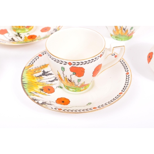 33 - A 1930S Art Deco hand painted 'Poppy' Pattern tea set by Crown Ducal. To comprise six cups, five sau... 