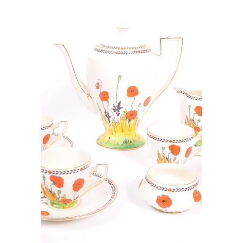 33 - A 1930S Art Deco hand painted 'Poppy' Pattern tea set by Crown Ducal. To comprise six cups, five sau... 