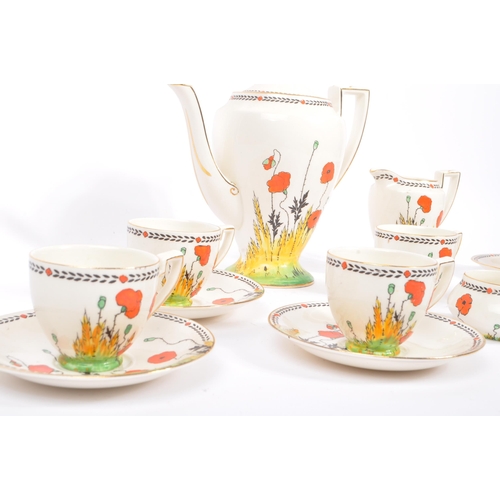 33 - A 1930S Art Deco hand painted 'Poppy' Pattern tea set by Crown Ducal. To comprise six cups, five sau... 