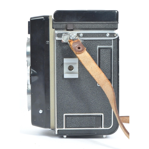 330 - A mid 20th century circa 1960s Franke and Heidecke Rollei Magic medium format TLR camera. The camera... 