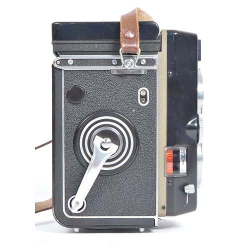 330 - A mid 20th century circa 1960s Franke and Heidecke Rollei Magic medium format TLR camera. The camera... 