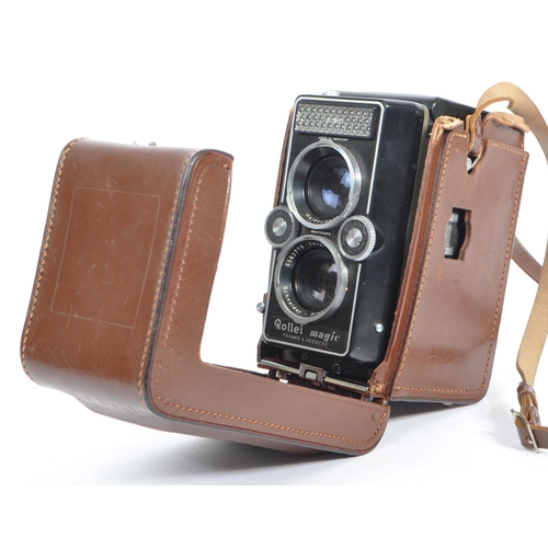 330 - A mid 20th century circa 1960s Franke and Heidecke Rollei Magic medium format TLR camera. The camera... 