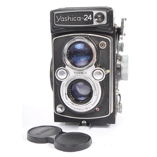 332 - A mid 20th century Yashica Yashicamat Yashica-24 medium format 6x6 TLR camera. The TLR camera having... 