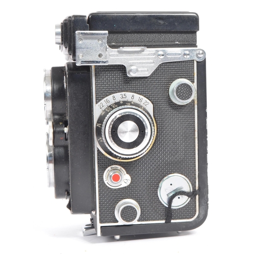 332 - A mid 20th century Yashica Yashicamat Yashica-24 medium format 6x6 TLR camera. The TLR camera having... 