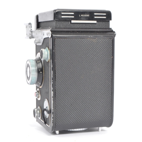 332 - A mid 20th century Yashica Yashicamat Yashica-24 medium format 6x6 TLR camera. The TLR camera having... 