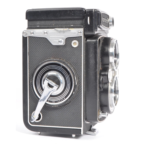 332 - A mid 20th century Yashica Yashicamat Yashica-24 medium format 6x6 TLR camera. The TLR camera having... 