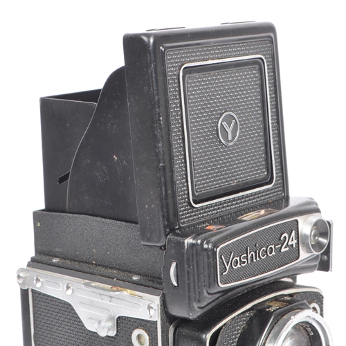 332 - A mid 20th century Yashica Yashicamat Yashica-24 medium format 6x6 TLR camera. The TLR camera having... 