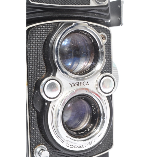 332 - A mid 20th century Yashica Yashicamat Yashica-24 medium format 6x6 TLR camera. The TLR camera having... 