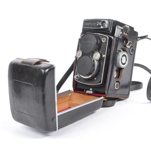 332 - A mid 20th century Yashica Yashicamat Yashica-24 medium format 6x6 TLR camera. The TLR camera having... 