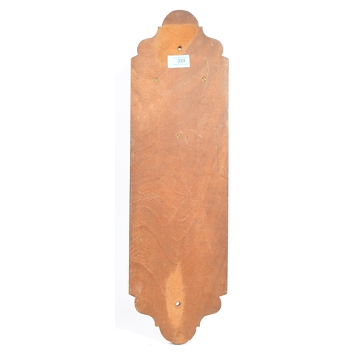 333 - Arts and Crafts style early 20th century toilet roll holder. Copper effect plaque with 