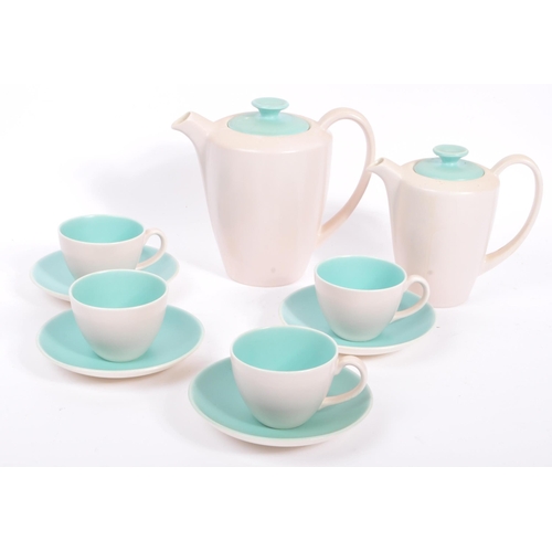 34 - A vintage 20th century circa 1960s Poole Pottery two tone tea / coffee service set. With a solid sky... 