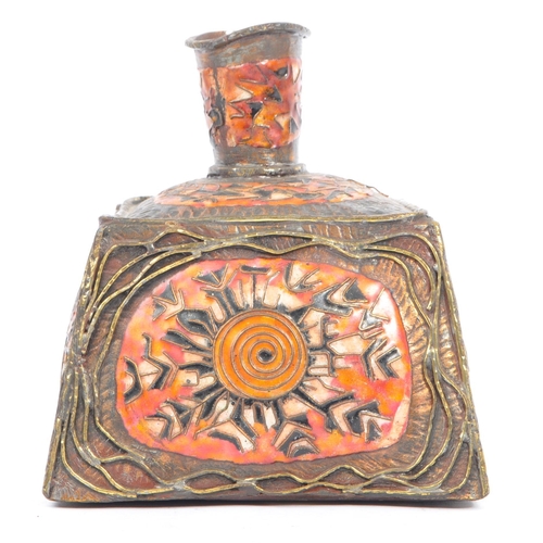 344 - An early 20th century Middle Eastern influence enamelled brass vase. The vase having a square base, ... 