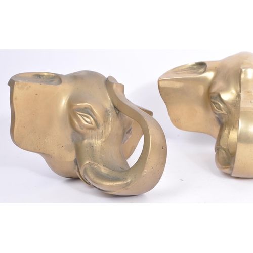 354 - A collection of three brass elephant head bar rail holder brackets. Each bracket being in the form o... 