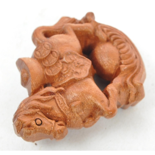 361 - A collection of 19th century Japanese netsuke carved wooden figures. Comprising of a turtle, monkey ... 