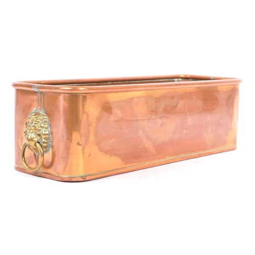 366 - A 19th century Victorian copper lion's head planter. The planter of rectangular form, with a rolled ... 