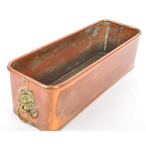 366 - A 19th century Victorian copper lion's head planter. The planter of rectangular form, with a rolled ... 