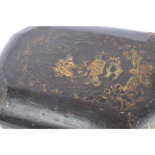 367 - A 19th century Chinese Cantonese black lacquered tea caddy box. The box having a black lacquered fin... 