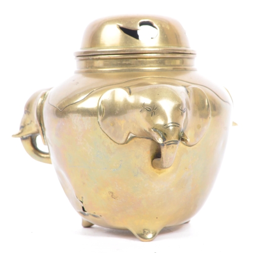 369 - An early 20th century brass elephant head censor pot. The censor having a bulbous brass body with pr... 