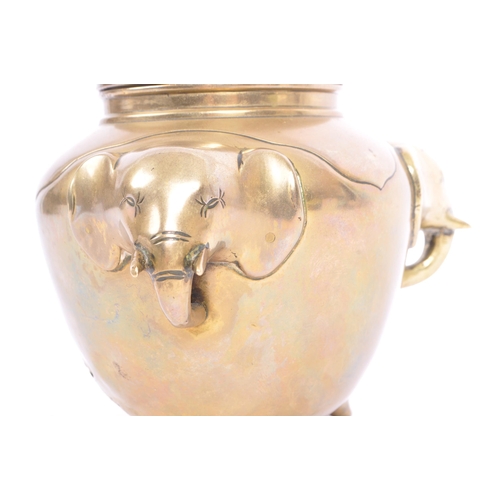 369 - An early 20th century brass elephant head censor pot. The censor having a bulbous brass body with pr... 