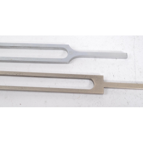 374 - Two vintage 20th century tuning forks. A acoustic resonator in the form of a two-pronged fork with t... 