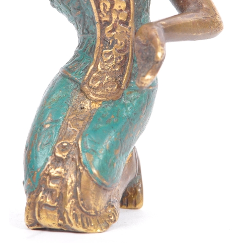 377 - A 20th century bronze Balinese Dewi Tara figure. The figure in the form of a kneeling goddess / deit... 