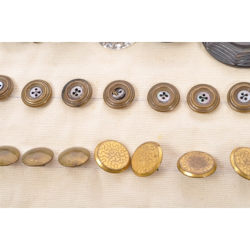 378 - An assorted collection of antique Victorian, Georgian and later 20th century buttons and buckles. Th... 