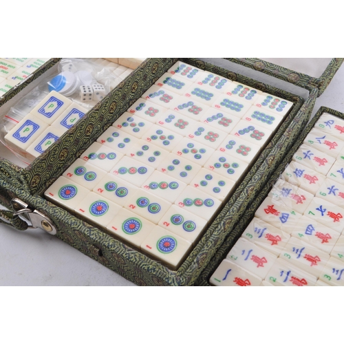 381 - A contemporary Mah Jong Chinese board game. Having counters and stick, some still in cellophane. Wit... 