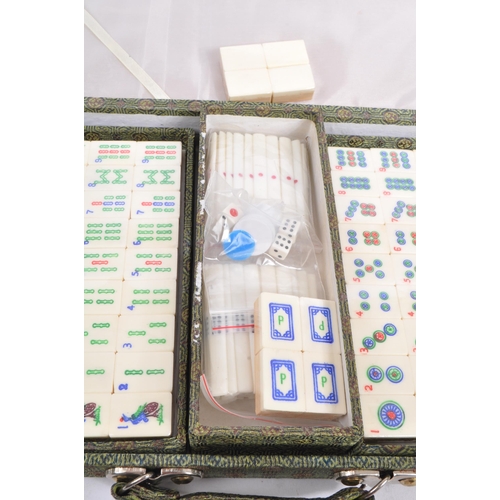 381 - A contemporary Mah Jong Chinese board game. Having counters and stick, some still in cellophane. Wit... 