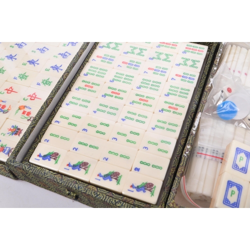 381 - A contemporary Mah Jong Chinese board game. Having counters and stick, some still in cellophane. Wit... 