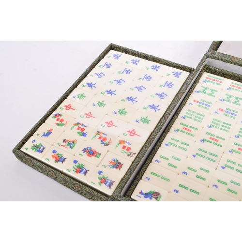 381 - A contemporary Mah Jong Chinese board game. Having counters and stick, some still in cellophane. Wit... 