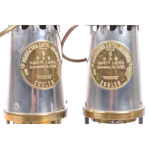 384 - A pair of 20th century brass and metal miners lamps. Manufactured by The Protector Lamp & lighting C... 