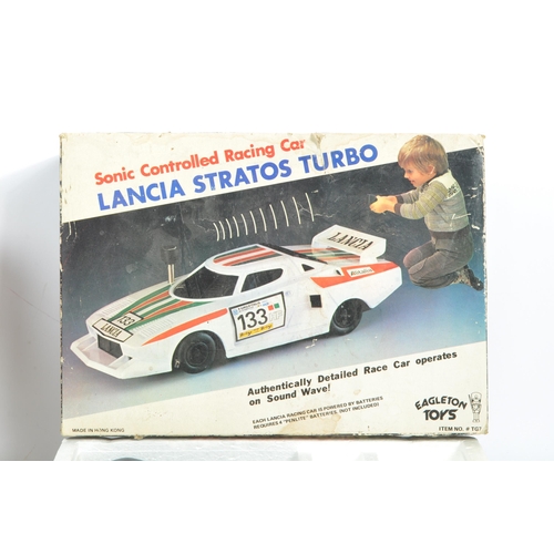 385 - Motor Racing Interest - Two late 20th century RC radio controlled Ferrari and Lancai race car toys. ... 