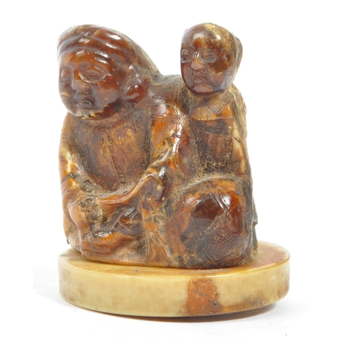 386 - A collection of late 19th century Japanese netsuke carved fruit wood figures. Comprising of a teapot... 