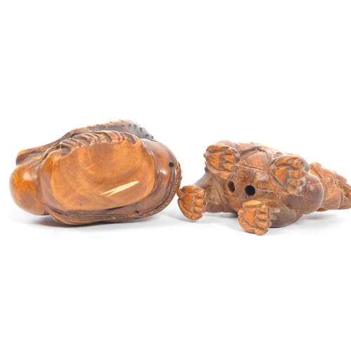 388 - A collection of three 19th century Japanese netsuke carved wooden figures. Comprising of mythical cr... 